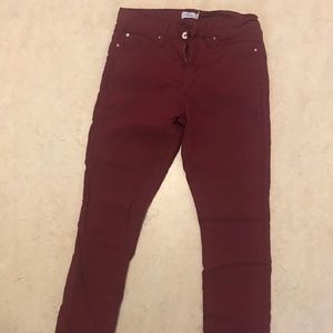 Stretchy maroon jeans.